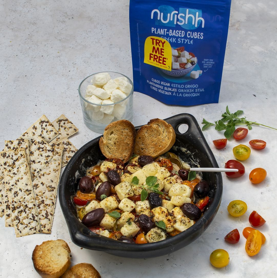Photo shows an olive and cheese-based dish made with Nurishh vegan cheese