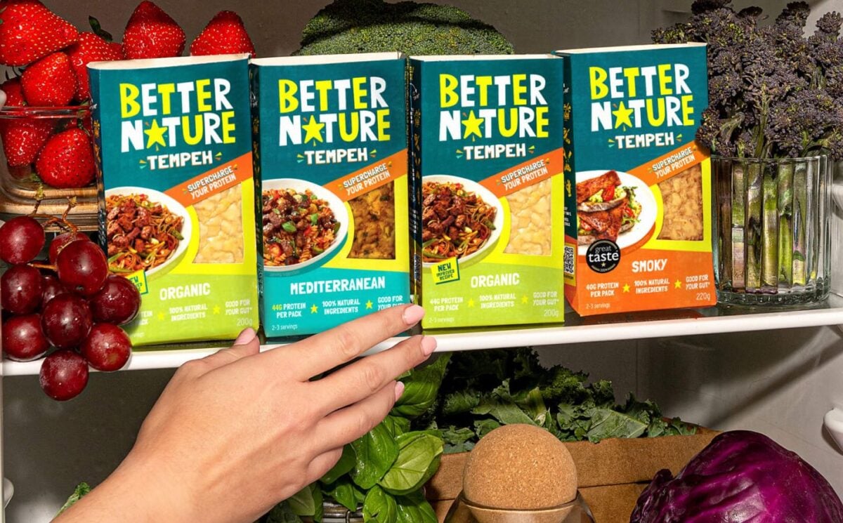 Photo showss someone reaching for a pack of the new mediterranean tempeh from Better Nature