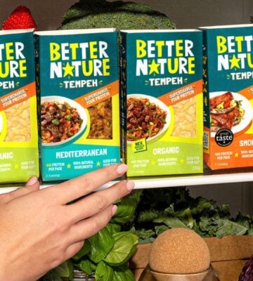 Photo showss someone reaching for a pack of the new mediterranean tempeh from Better Nature