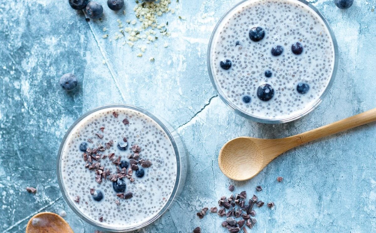 two bowls of blueberries and cream chia pudding for vegan summer breakfast ideas