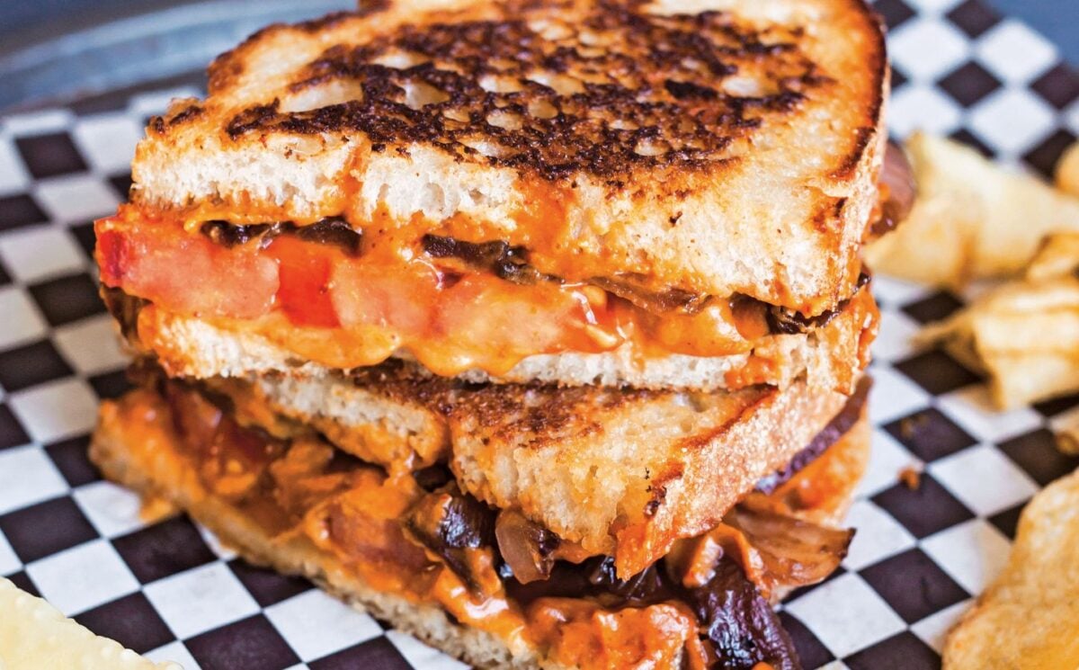 a vegan chipotle grilled cheese with caramelized onions made with cashew cheese