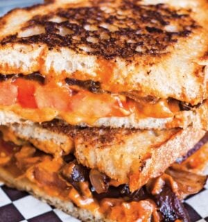 a vegan chipotle grilled cheese with caramelized onions made with cashew cheese