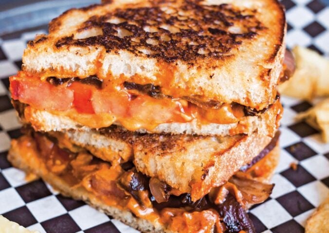 a vegan chipotle grilled cheese with caramelized onions made with cashew cheese