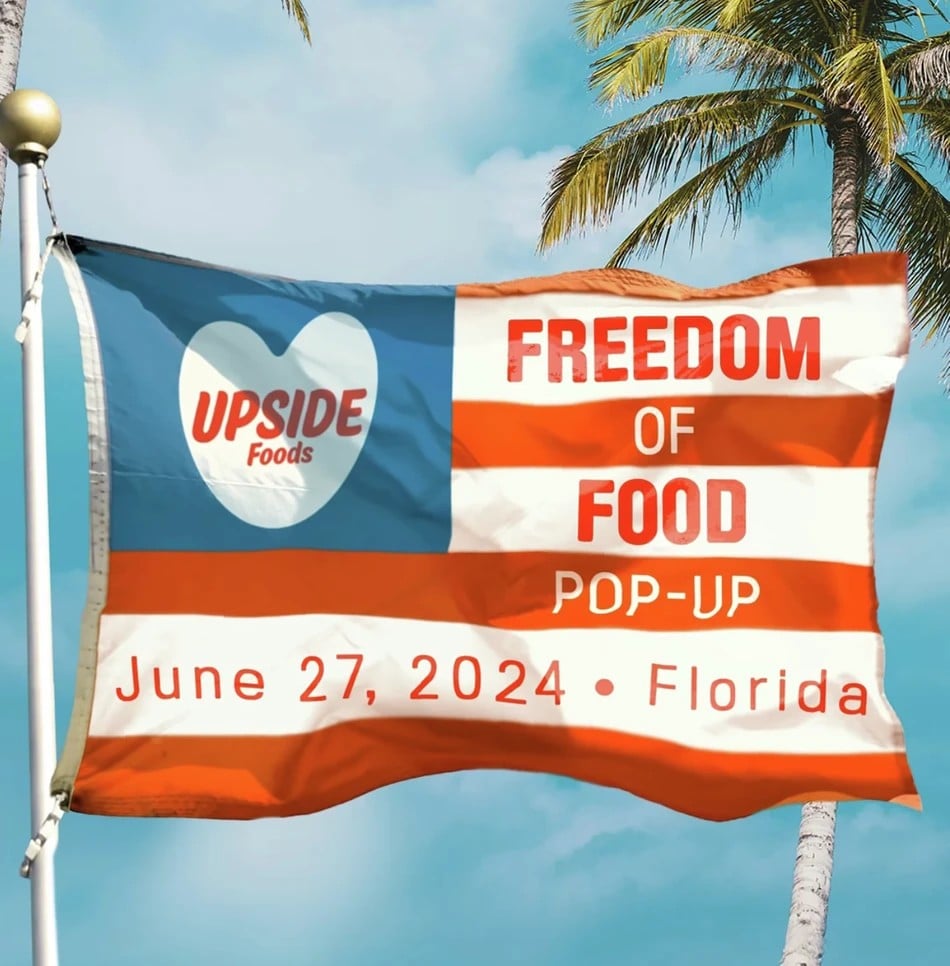 Photo shows a poster for the UPSIDE Foods "Freedom of Food Pop-Up" tasting event for cultivated meat