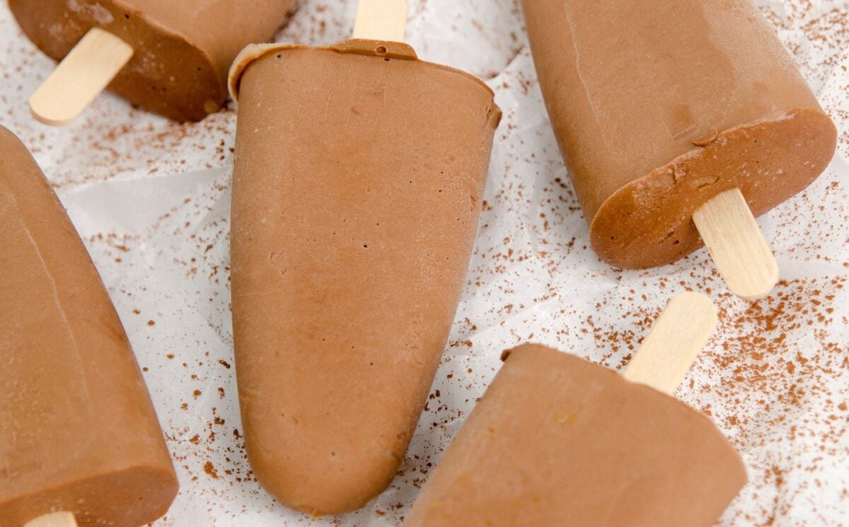 homemade vegan fudgesicles made with cocoa powder, nut butter, plant-based milk, and coconut sugar