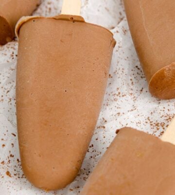 homemade vegan fudgesicles made with cocoa powder, nut butter, plant-based milk, and coconut sugar