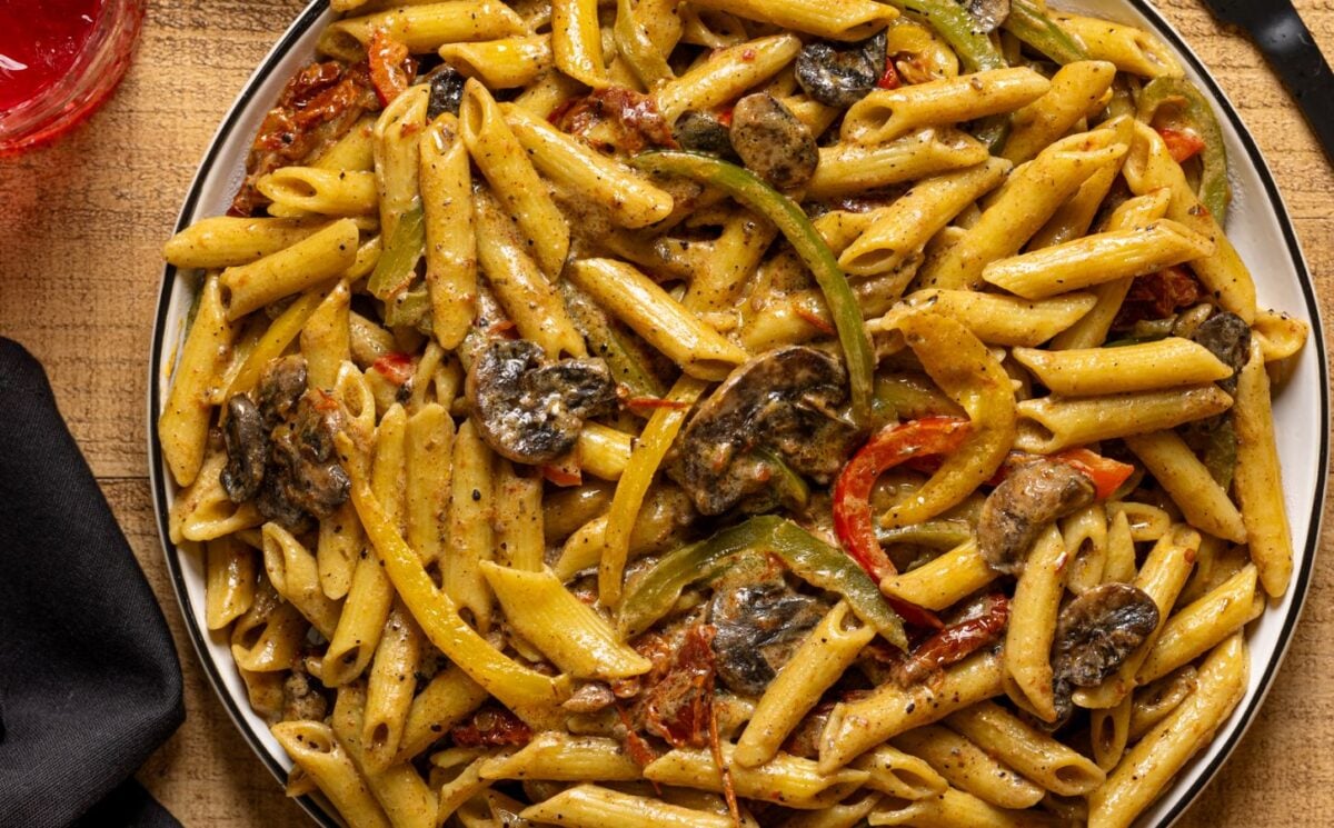 vegan grand rasta pasta with three colors of bell pepper