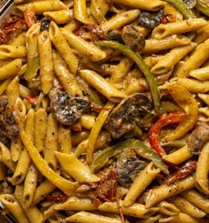vegan grand rasta pasta with three colors of bell pepper