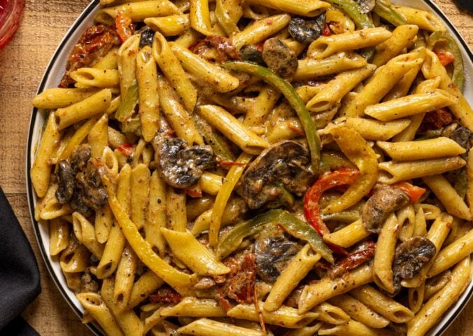 vegan grand rasta pasta with three colors of bell pepper