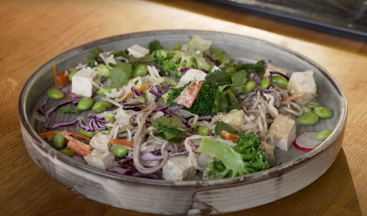 A vegan high protein plant-based work lunch in a bowl featuring tofu and sweet potato
