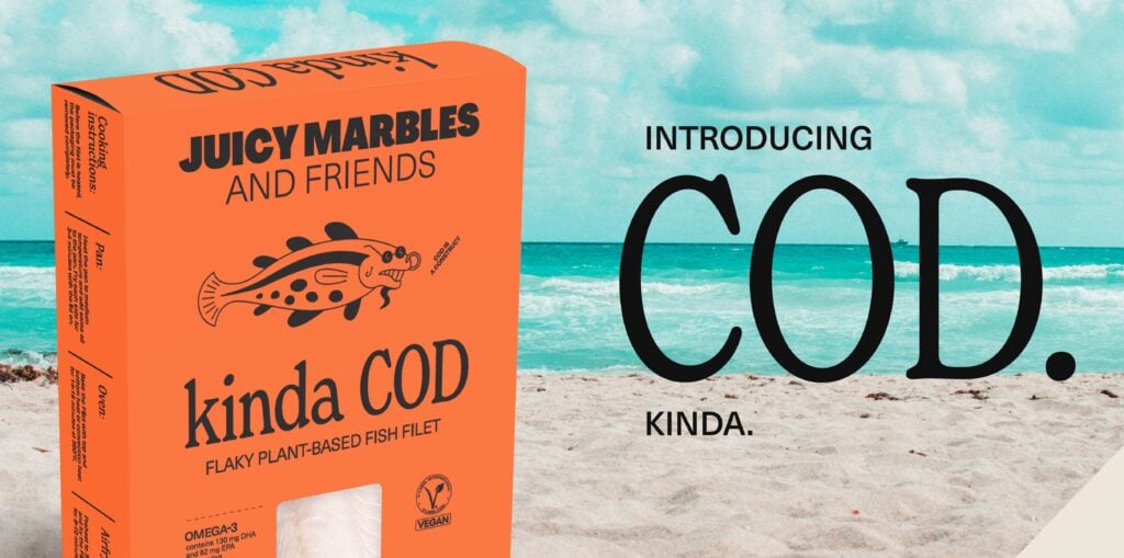 An orange pack of Juicy Marbles vegan Kinda Cod in front of a beach background next to the words "Introducing Cod, Kinda"