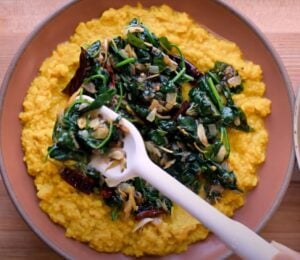 A vegan lentil recipe, dal palak, in a bowl on a kitchen counter