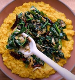 A vegan lentil recipe, dal palak, in a bowl on a kitchen counter