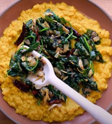 A vegan lentil recipe, dal palak, in a bowl on a kitchen counter