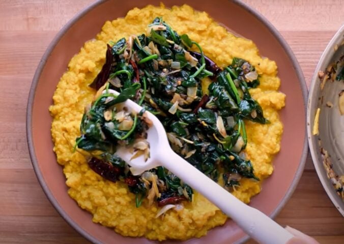 A vegan lentil recipe, dal palak, in a bowl on a kitchen counter