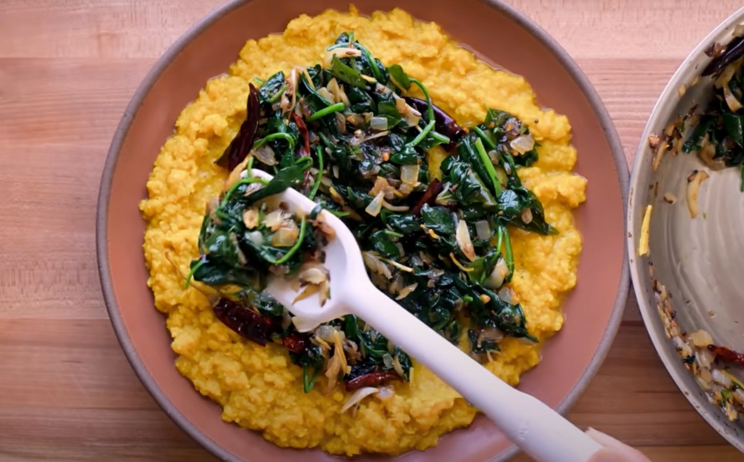 A vegan lentil recipe, dal palak, in a bowl on a kitchen counter