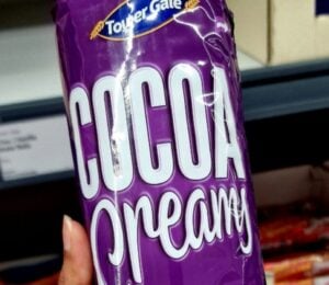 Photo shows someone holding up a pack of Lidl's new "Cocoa Creamy" vegan biscuits