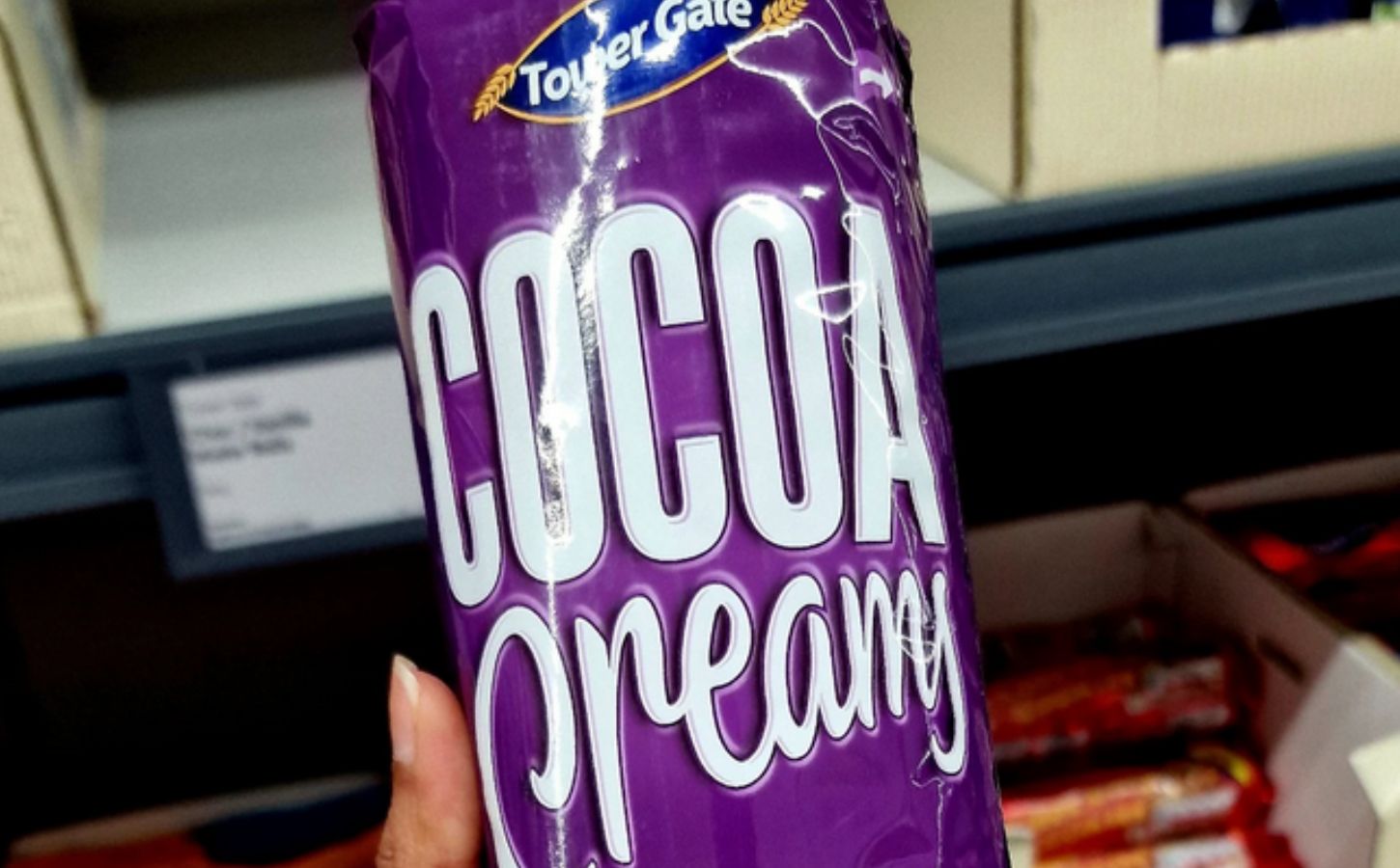 Photo shows someone holding up a pack of Lidl's new "Cocoa Creamy" vegan biscuits