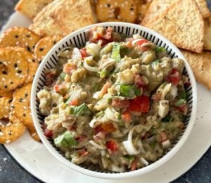 A roasted aubergine salad with some crackers