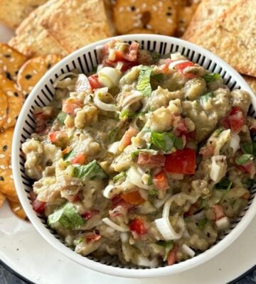 A roasted aubergine salad with some crackers