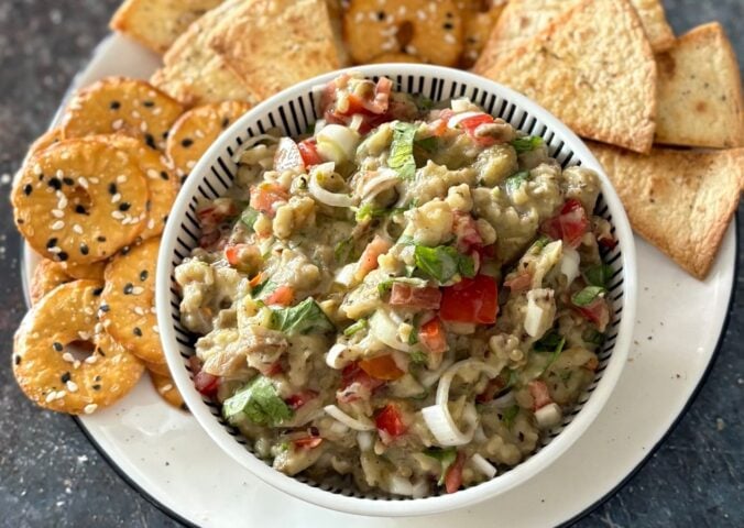 A roasted aubergine salad with some crackers