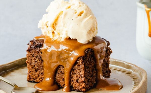 vegan sticky date cake with toffee and vanilla ice cream
