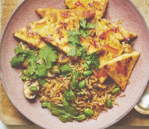 Vegan sticky marmalade tofu cut into thin triangles