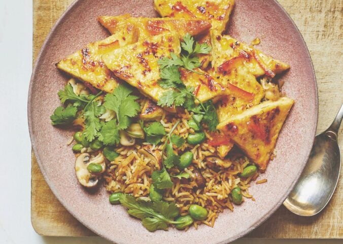 Vegan sticky marmalade tofu cut into thin triangles