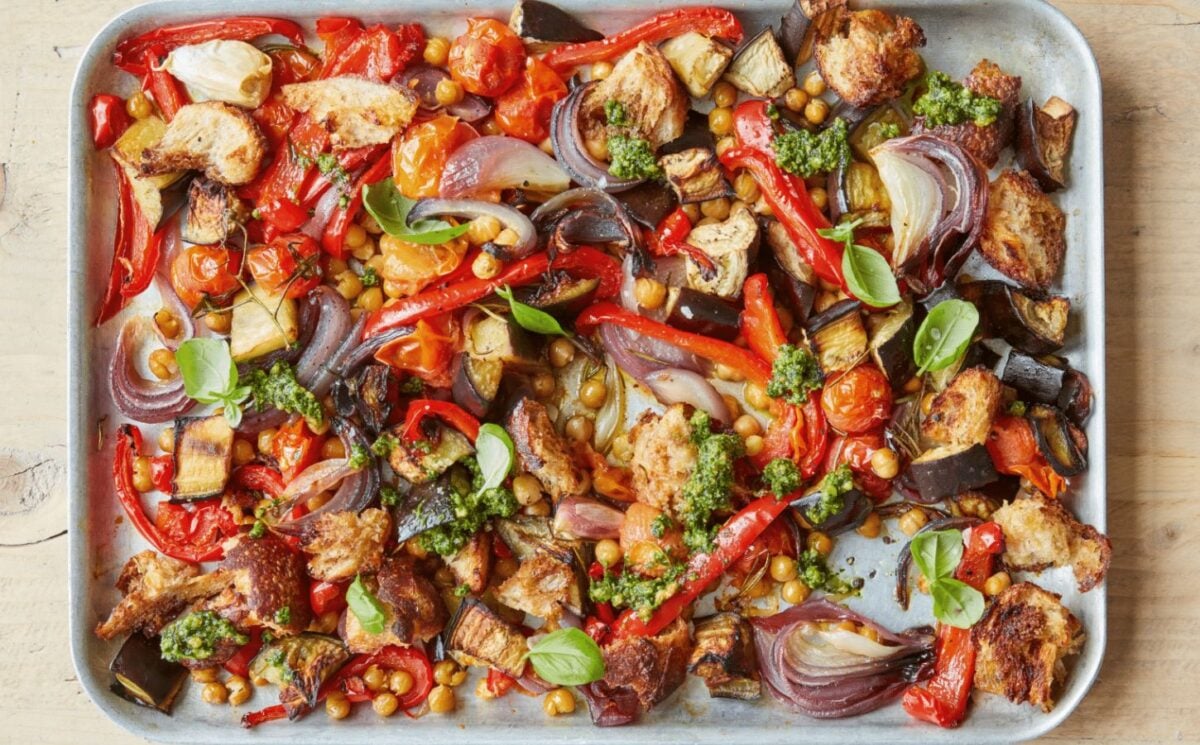 A tray of simple roasted summer veg with chickpeas and sourdough for vegan summer dinner ideas