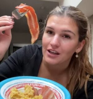 Nicole Whittle holds up vegan bacon during her one-day experiment trying the carnivore diet using only plant-based meat alternatives.