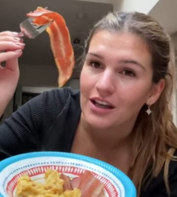 Nicole Whittle holds up vegan bacon during her one-day experiment trying the carnivore diet using only plant-based meat alternatives.