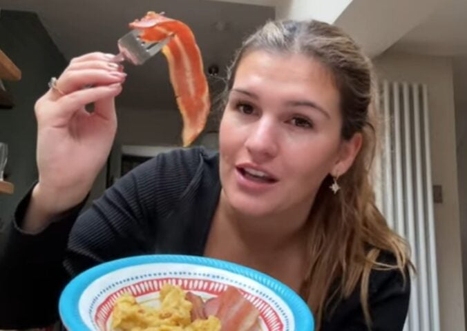 Nicole Whittle holds up vegan bacon during her one-day experiment trying the carnivore diet using only plant-based meat alternatives.