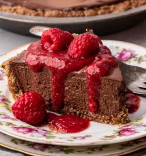 vegan chocolate cheesecake with raspberry coulis and a no-bake filling