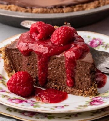 vegan chocolate cheesecake with raspberry coulis and a no-bake filling