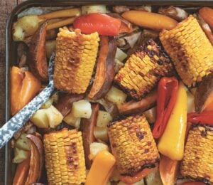 warming jerk jackfruit with corn, peppers, and pineapple
