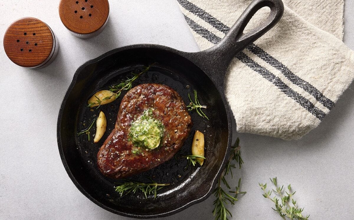 Photo shows the Beyond Steak Filet in a cast iron pan
