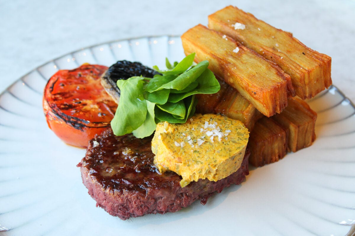 Photo shows the new, signature steak frites dish from BOA Steakhouse featuring the Beyond Steak Filet