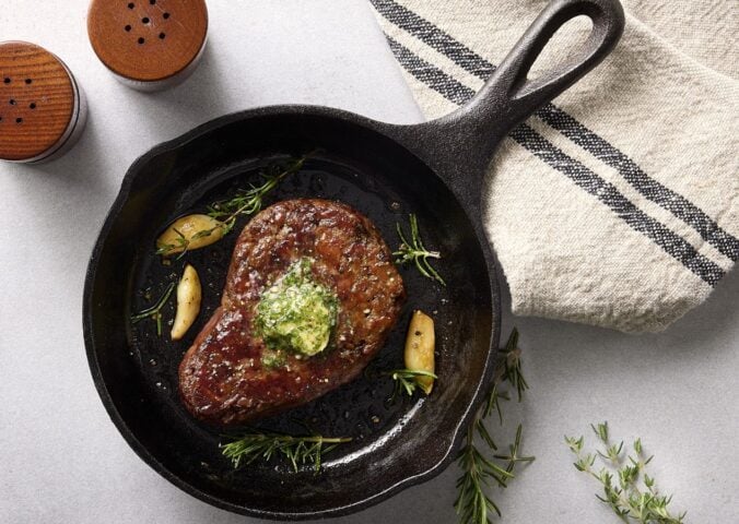 Photo shows the Beyond Steak Filet in a cast iron pan