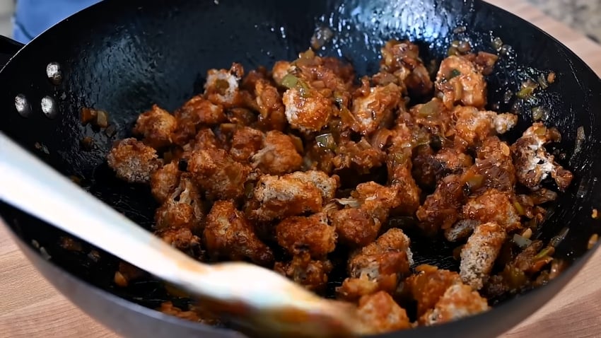 Nisha Vora stir fries crispy Gobi Manchurian in a wok