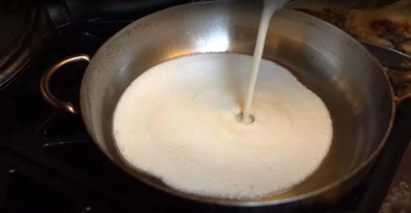 Miyoko Schinner pours the mung bean vegan egg batter onto a stainless steel pan
