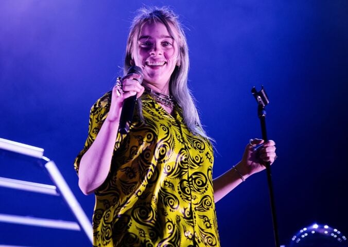 Photo shows Billie Eilish mid-performance in Spain