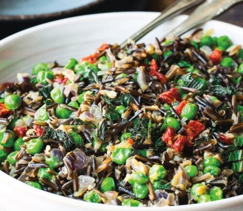 black rice peas with onion, sun-dried tomatoes, and mint leaves