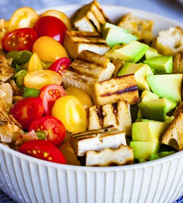 a bowl of California cobb salad with smoky coconut bacon