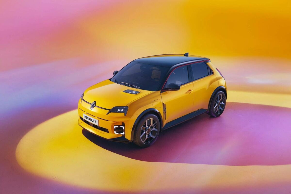 Photo shows the new Renault 5 E-Tech Electric in yellow against a bright computer-generated background