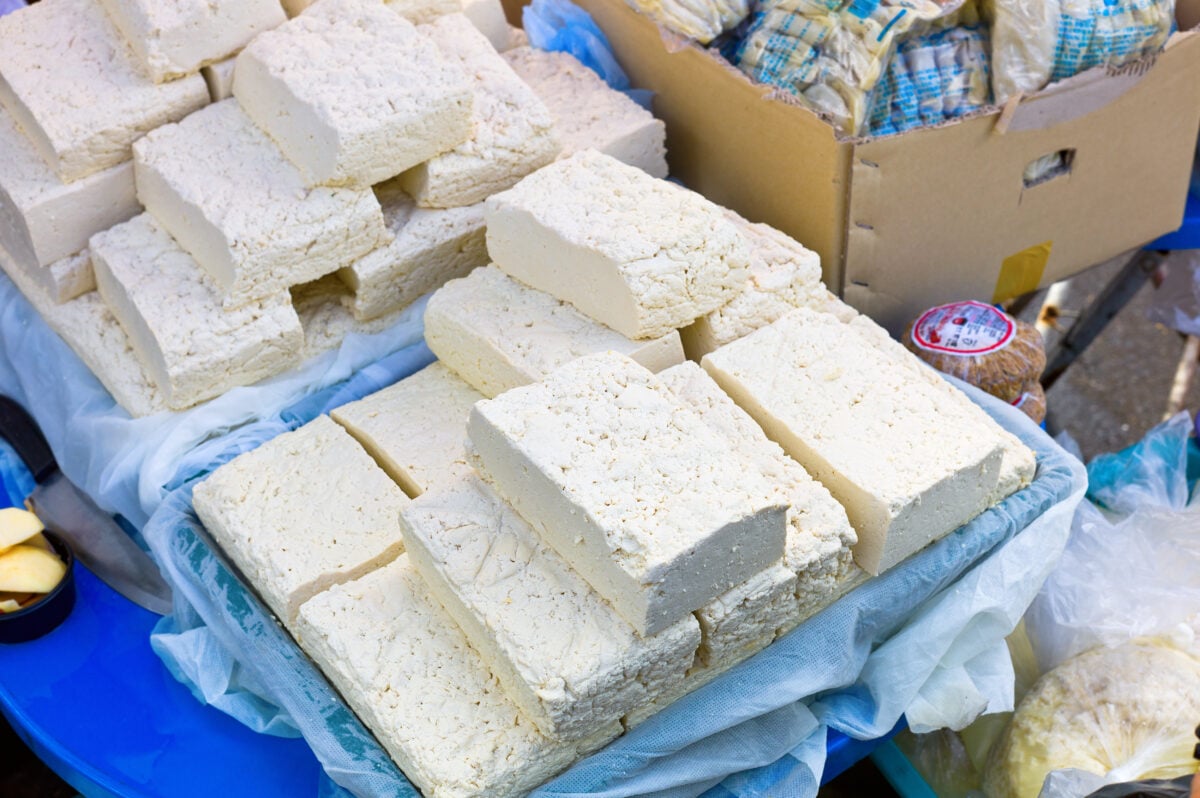 Photo shows a stack of blocks of tofu at a marketplace in Japan