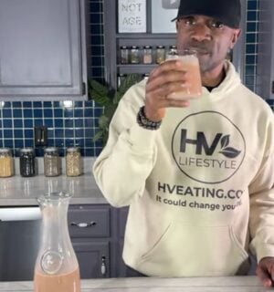 Javant at Healthy Vegan Eating drinking his creamy chocolate oat milk recipe