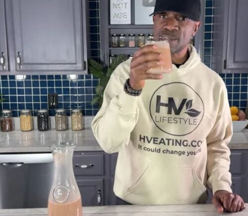 Javant at Healthy Vegan Eating drinking his creamy chocolate oat milk recipe