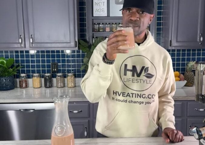 Javant at Healthy Vegan Eating drinking his creamy chocolate oat milk recipe