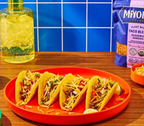Photo shows the packaging for Oat Milk Taco Blend Seasoned Shreds, the newest vegan cheese from Miyoko's Creamery, as well as a selection of dishes featuring it, including tacos