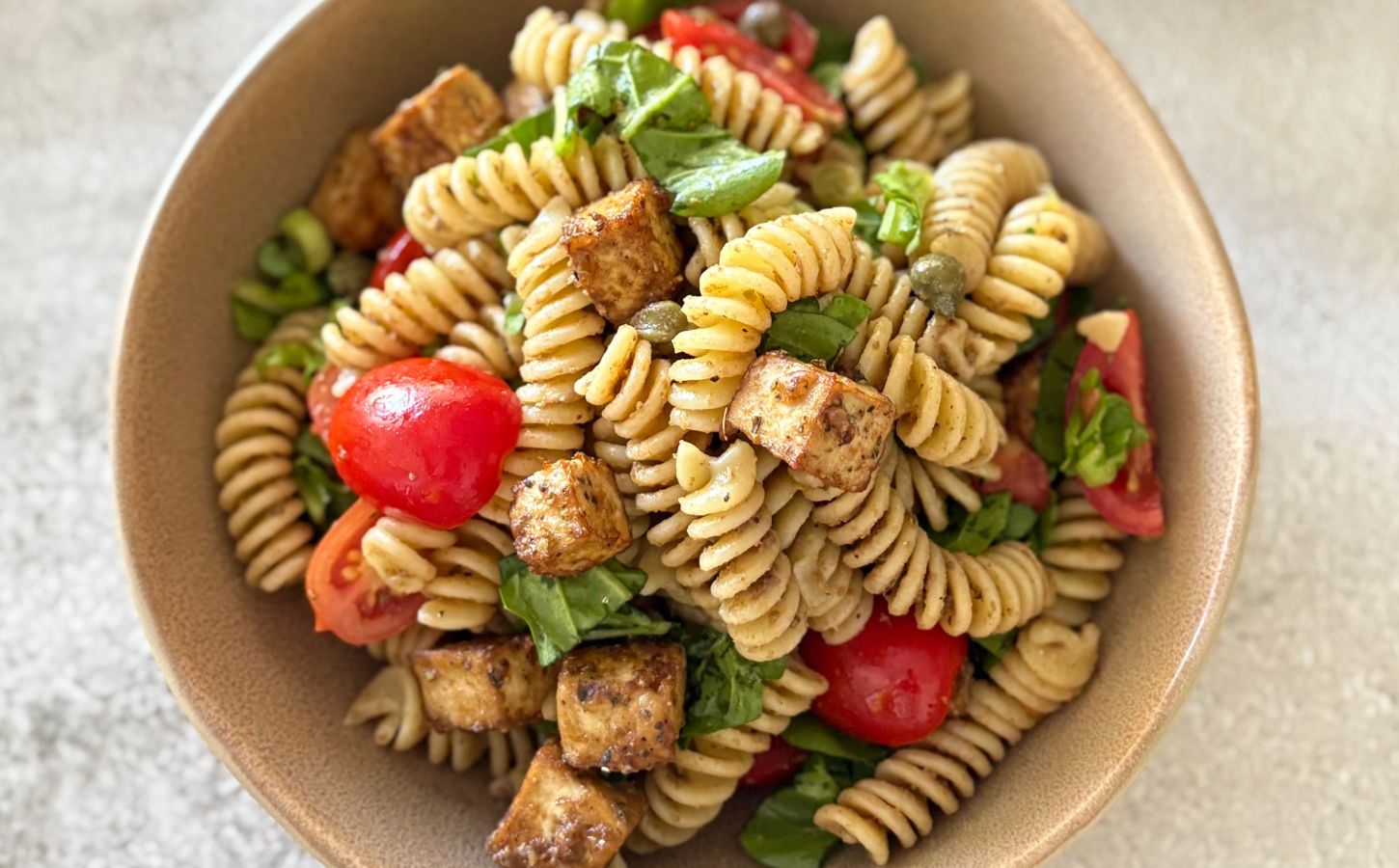 A bowl of olive paste pasta salad, a vegan pasta salad recipe